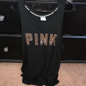 A black and gold tank top from Victoria secrets